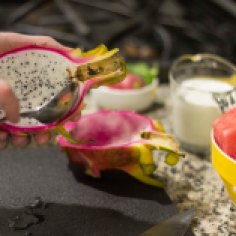 Scooping Fruit from Dragon Fruit